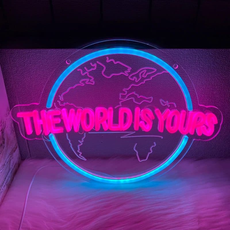Cartel de neón The World Is Yours con globo azul y letras rosas